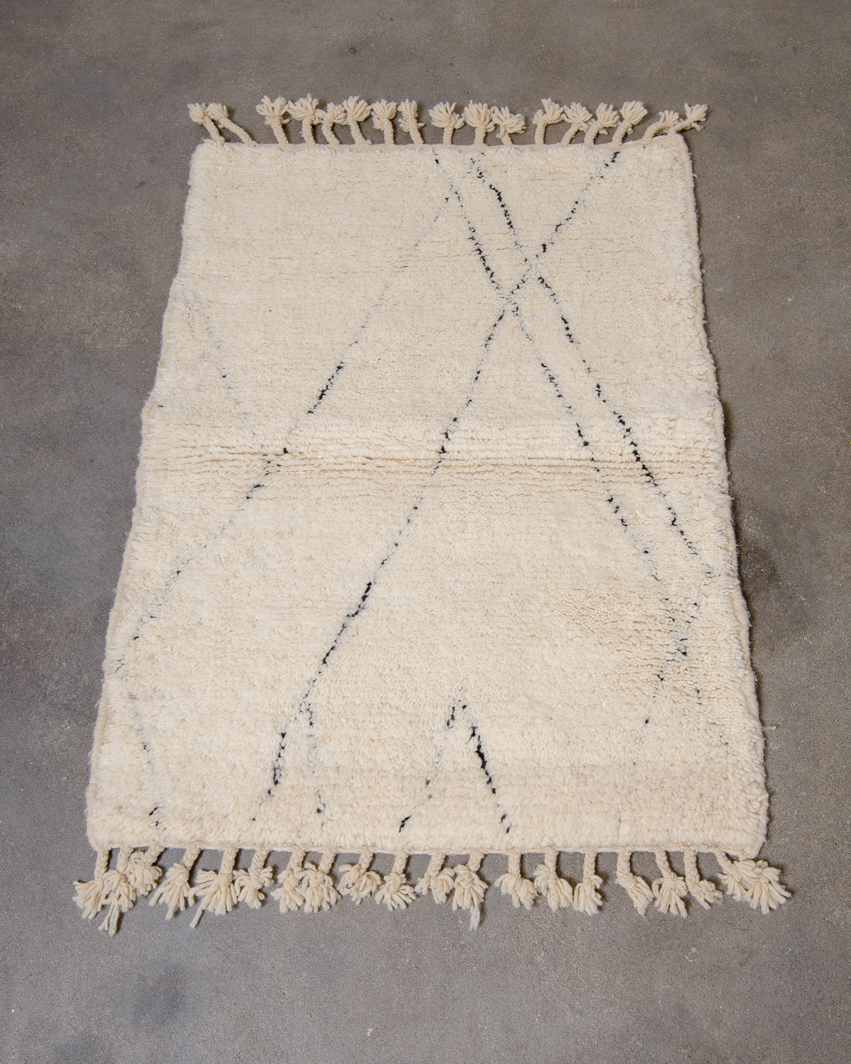 Modern, designer, handcrafted Berber rug from Morocco. Beniourain carpet with minimalist design, natural wool pile and a fluffy texture.